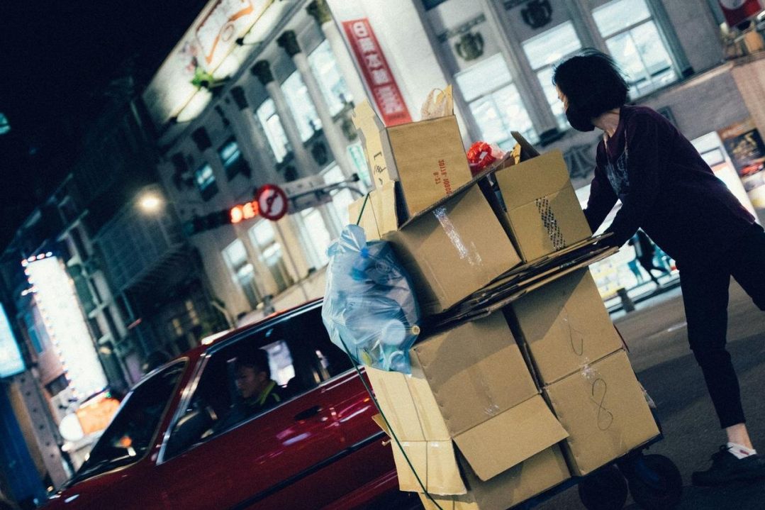 Courier with parcel at doorstep